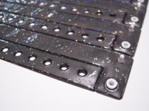 Must vinüülkäepael glitterkihiga.